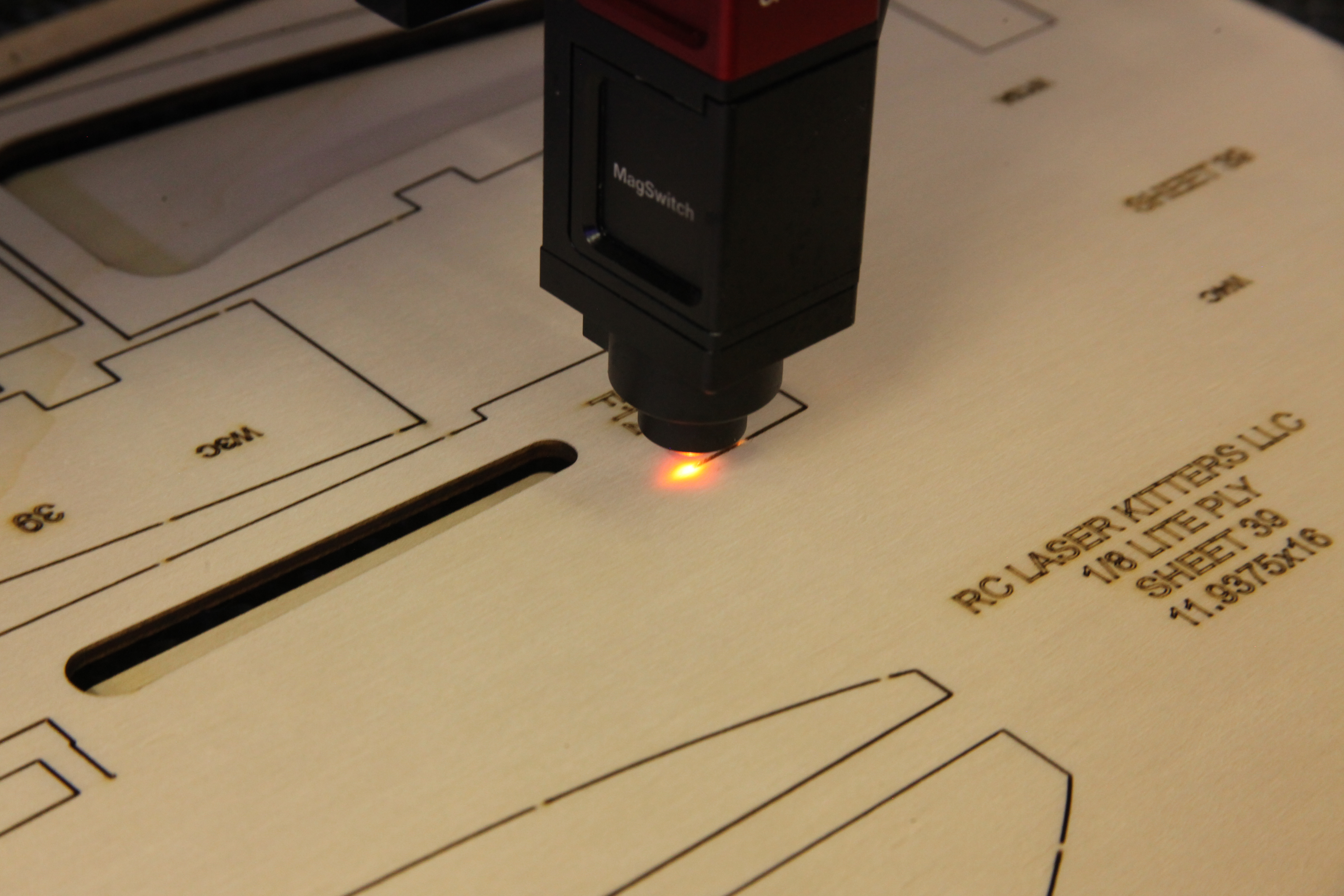 Laser cutter in operation cutting RC plane components