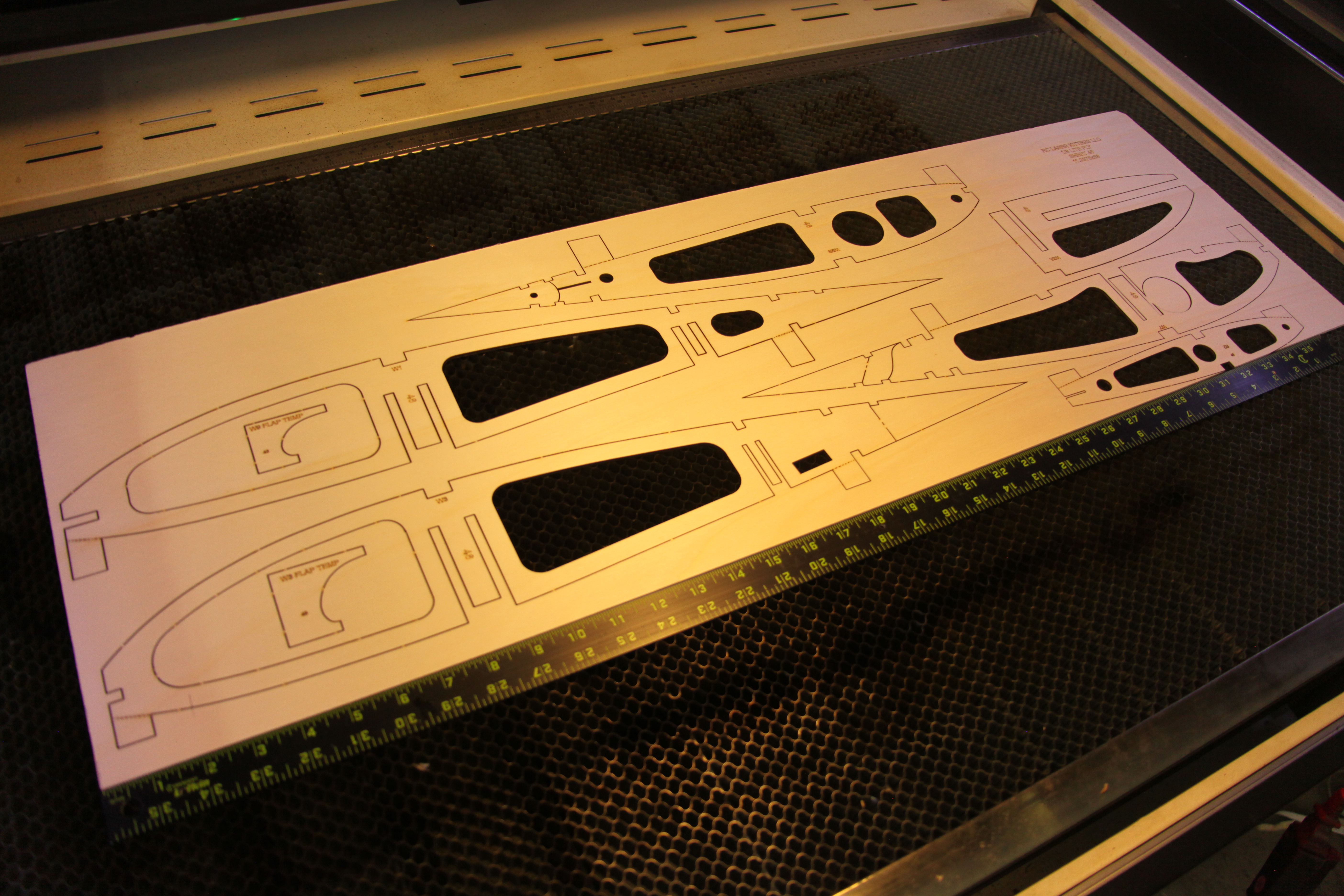 Laser cutter in operation cutting RC plane components